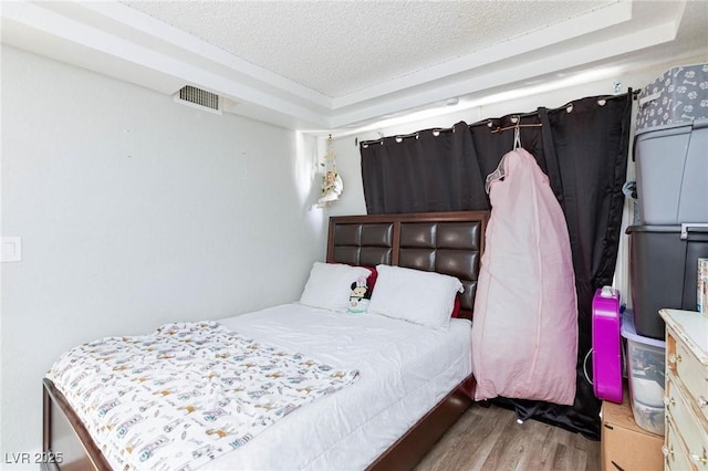 45 N Lamb Blvd, Las Vegas, NV 89110 - bedroom with wood finished floors and a textured ceiling