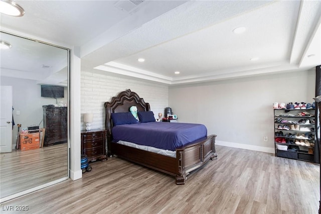 45 N Lamb Blvd, Las Vegas, NV 89110 - bedroom featuring a raised ceiling, wood finished floors, baseboards, and recessed lighting