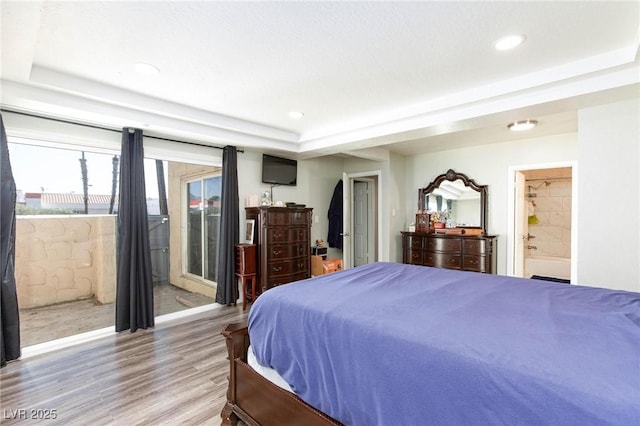 45 N Lamb Blvd, Las Vegas, NV 89110 - bedroom featuring a raised ceiling, access to outside, light wood-type flooring, recessed lighting, and ensuite bath
