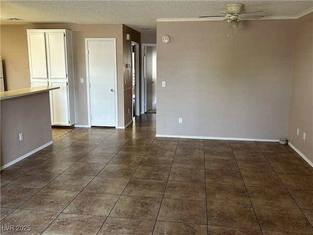 6865 Tamarus St Unit 202, Las Vegas, NV 89119 - empty room with ceiling fan, a textured ceiling, baseboards, a smoke detector, and dark tile patterned floors