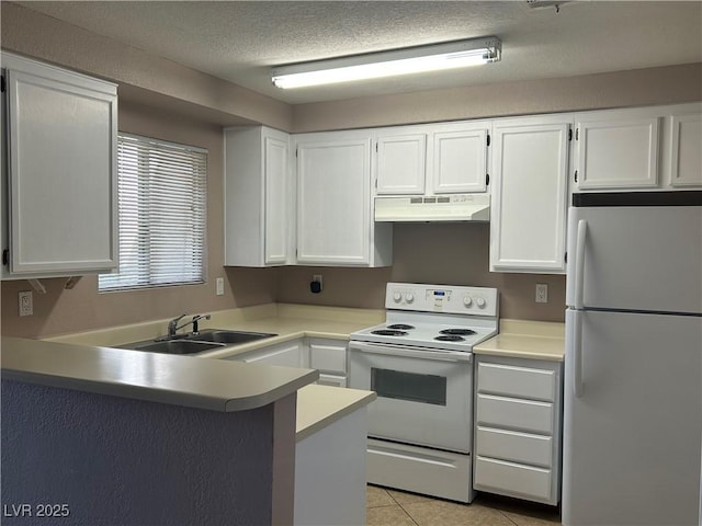 6865 Tamarus St Unit 202, Las Vegas, NV 89119 - kitchen with white appliances, under cabinet range hood, a sink, white cabinets, and light tile patterned floors
