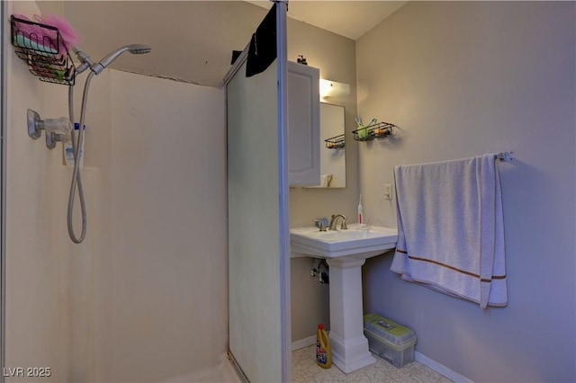 4445 Peterson Dr, Las Vegas, NV 89103 - bathroom featuring a shower stall and baseboards