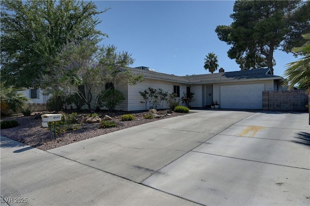 4445 Peterson Dr, Las Vegas, NV 89103 - ranch-style home with a garage and driveway