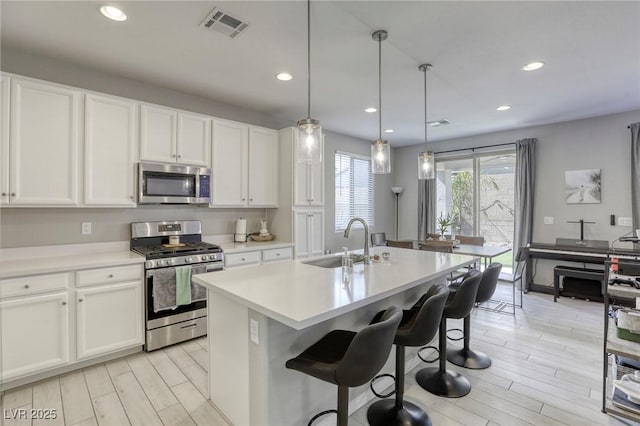 7061 Tilligerry St, North Las Vegas, NV 89084 - kitchen featuring appliances with stainless steel finishes, a sink, light wood finished floors, recessed lighting, and light countertops