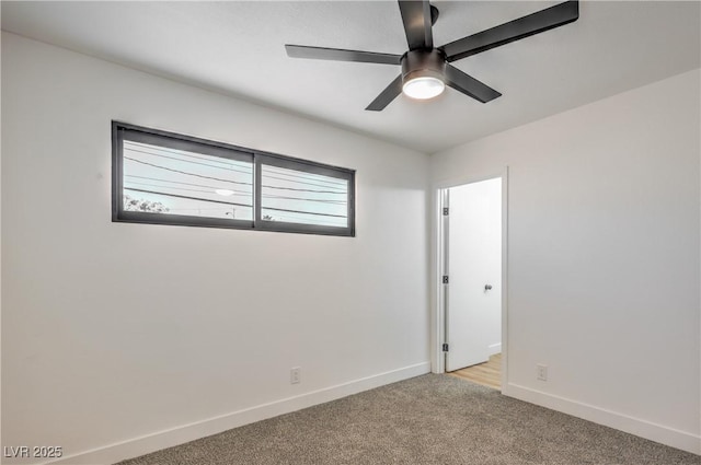 333 Rossmoyne Ave, North Las Vegas, NV 89030 - unfurnished room with light colored carpet, baseboards, and ceiling fan
