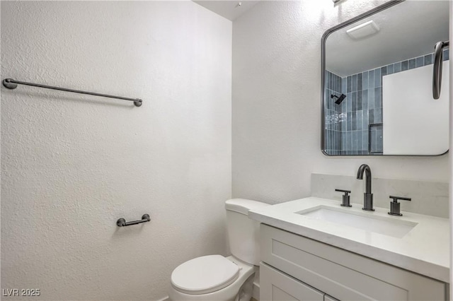 333 Rossmoyne Ave, North Las Vegas, NV 89030 - bathroom with toilet, a textured wall, vanity, and a shower