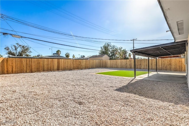 333 Rossmoyne Ave, North Las Vegas, NV 89030 - fenced backyard with a patio area