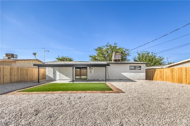333 Rossmoyne Ave, North Las Vegas, NV 89030 - rear view of property featuring a fenced backyard, a patio, and stucco siding