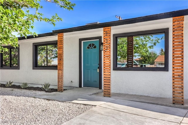 333 Rossmoyne Ave, North Las Vegas, NV 89030 - doorway to property with stucco siding