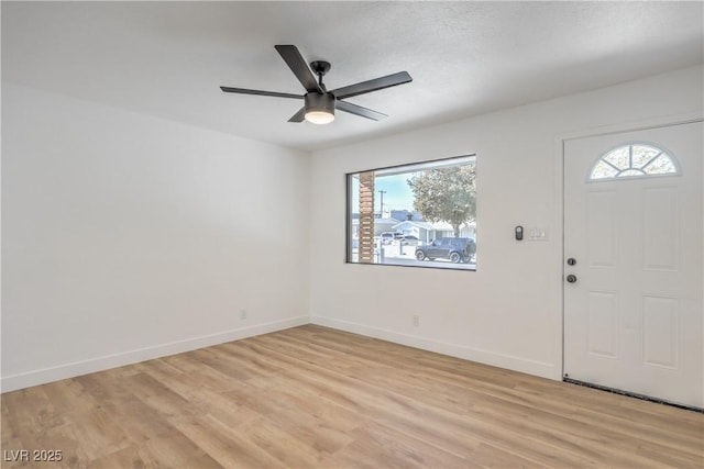 333 Rossmoyne Ave, North Las Vegas, NV 89030 - foyer featuring plenty of natural light, light wood-type flooring, ceiling fan, and baseboards