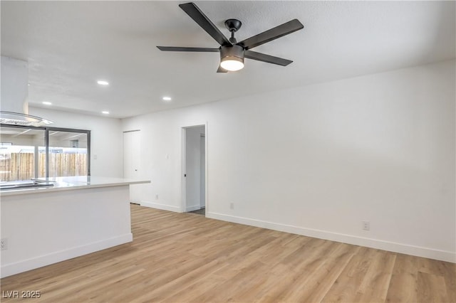 333 Rossmoyne Ave, North Las Vegas, NV 89030 - unfurnished living room with baseboards, light wood finished floors, recessed lighting, and ceiling fan