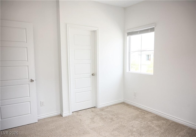 7342 N Decatur Blvd Unit 5, Las Vegas, NV 89131 - unfurnished bedroom featuring carpet flooring and baseboards