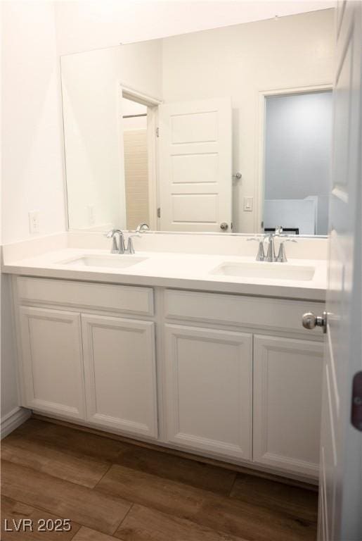 7342 N Decatur Blvd Unit 5, Las Vegas, NV 89131 - bathroom with double vanity and wood finished floors
