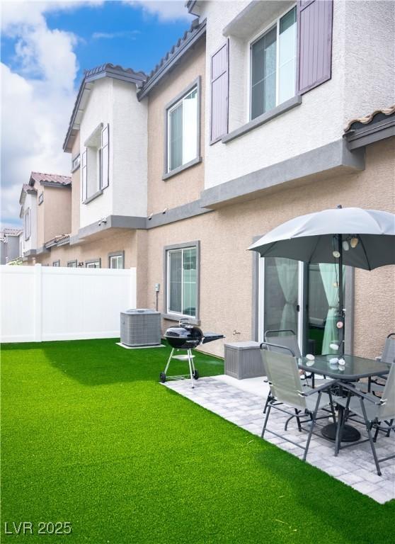 7342 N Decatur Blvd Unit 5, Las Vegas, NV 89131 - back of property featuring stucco siding, a patio area, and a tiled roof
