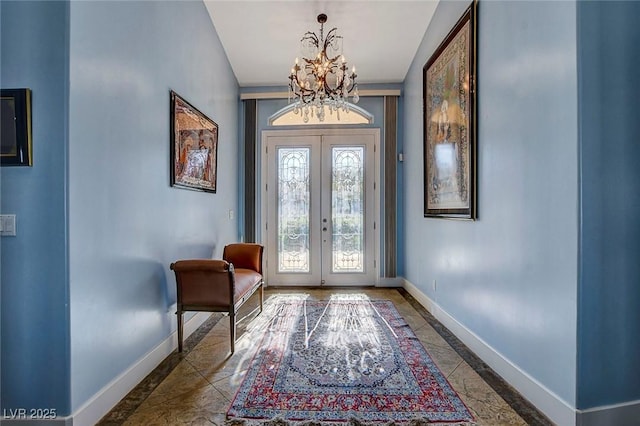 6230 Calm Brook Ct, Las Vegas, NV 89149 - entryway with inlaid floor details, baseboards, a chandelier, and french doors