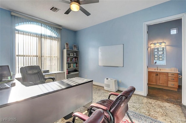 6230 Calm Brook Ct, Las Vegas, NV 89149 - office area featuring ceiling fan, a sink, and baseboards