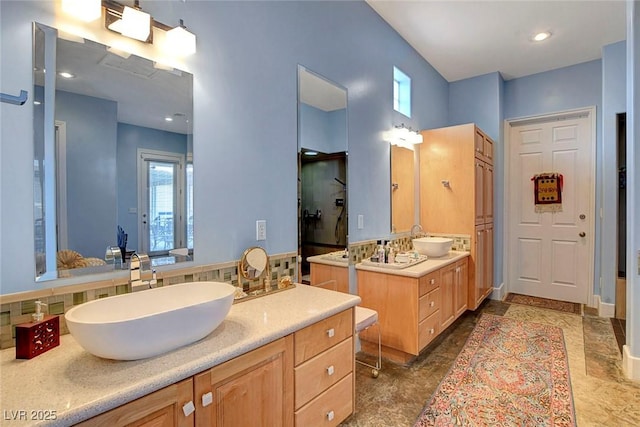 6230 Calm Brook Ct, Las Vegas, NV 89149 - full bathroom with two vanities and decorative backsplash