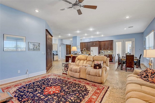 6230 Calm Brook Ct, Las Vegas, NV 89149 - living area with baseboards, a ceiling fan, and recessed lighting