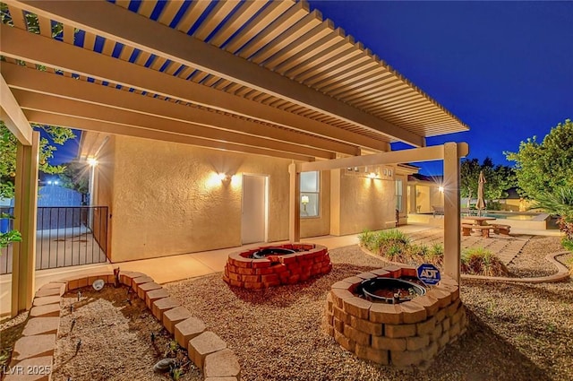 6230 Calm Brook Ct, Las Vegas, NV 89149 - patio at twilight with a fire pit and a patio area