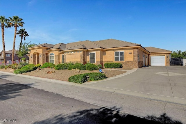 6230 Calm Brook Ct, Las Vegas, NV 89149 - view of front facade with an attached garage, concrete driveway, stone siding, and stucco siding