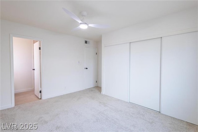 6170 W University Ave, Las Vegas, NV 89103 - unfurnished bedroom with carpet flooring, a closet, ensuite bathroom, and ceiling fan