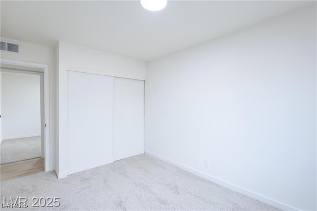6170 W University Ave, Las Vegas, NV 89103 - unfurnished bedroom featuring carpet, a closet, and baseboards
