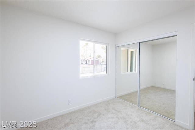 6170 W University Ave, Las Vegas, NV 89103 - unfurnished bedroom with carpet floors, a closet, and baseboards