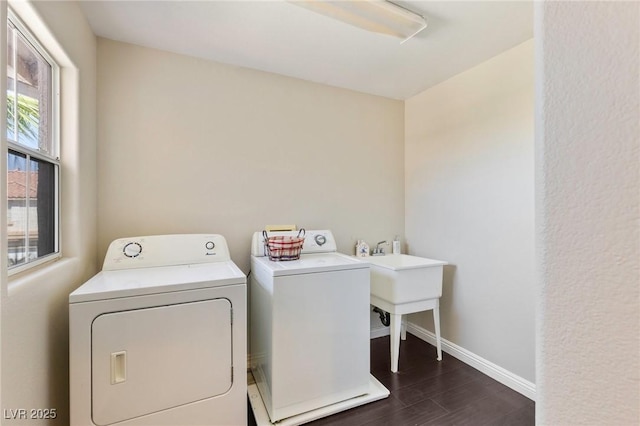 8507 Titania Ct, Las Vegas, NV 89147 - laundry room with washing machine and dryer, baseboards, and dark wood finished floors