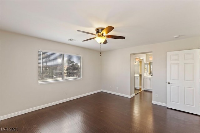 8507 Titania Ct, Las Vegas, NV 89147 - unfurnished bedroom with baseboards, wood finished floors, connected bathroom, and ceiling fan