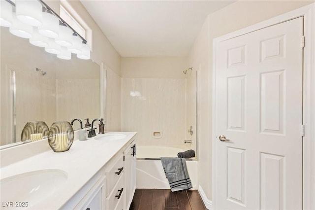 8507 Titania Ct, Las Vegas, NV 89147 - full bathroom with washtub / shower combination, double vanity, and wood finished floors