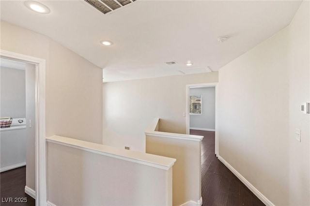 8507 Titania Ct, Las Vegas, NV 89147 - hall featuring an upstairs landing, baseboards, wood finished floors, recessed lighting, and washer / clothes dryer