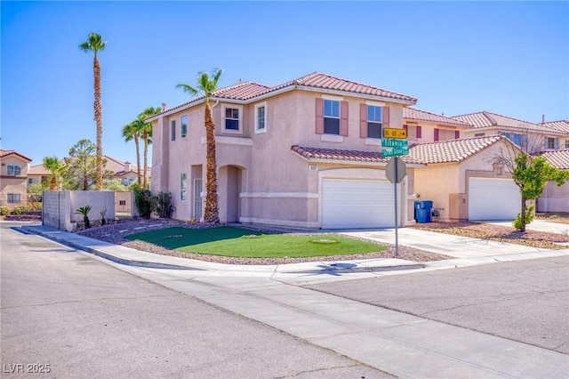 8507 Titania Ct, Las Vegas, NV 89147 - mediterranean / spanish-style home featuring stucco siding, a tiled roof, an attached garage, and driveway