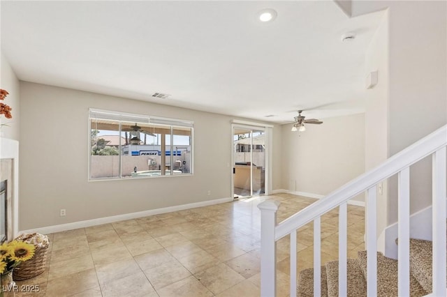 8507 Titania Ct, Las Vegas, NV 89147 - unfurnished living room with a ceiling fan, stairs, light tile patterned floors, and recessed lighting