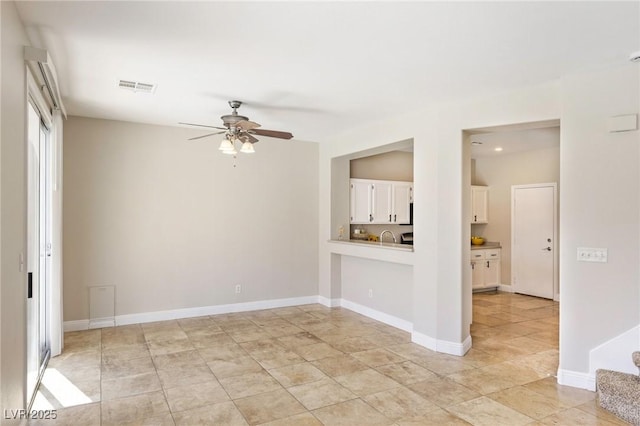 8507 Titania Ct, Las Vegas, NV 89147 - spare room featuring ceiling fan, baseboards, and recessed lighting