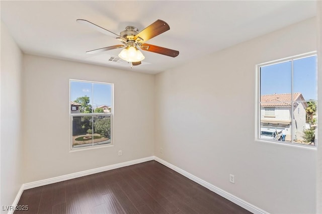 8507 Titania Ct, Las Vegas, NV 89147 - empty room featuring baseboards, a ceiling fan, and dark wood-style flooring