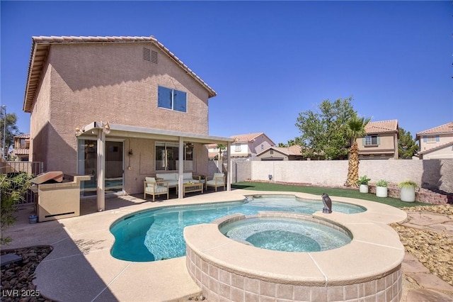 8507 Titania Ct, Las Vegas, NV 89147 - view of swimming pool with a patio area, a fenced backyard, a pool with connected hot tub, and an outdoor living space