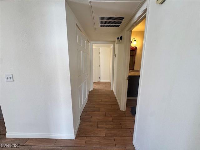 1505 Frank Aved St Unit 101, Las Vegas, NV 89110 - hallway featuring wood tiled floors and baseboards
