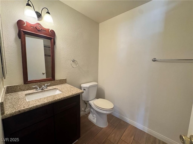 1505 Frank Aved St Unit 101, Las Vegas, NV 89110 - half bathroom featuring wood finished floors and vanity