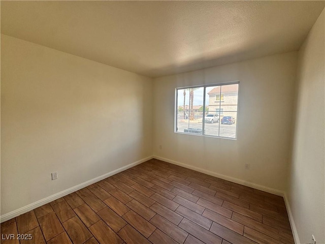 1505 Frank Aved St Unit 101, Las Vegas, NV 89110 - spare room with dark wood finished floors and a textured ceiling