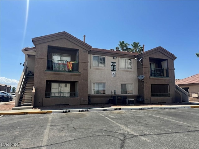 1505 Frank Aved St Unit 101, Las Vegas, NV 89110 - view of property with uncovered parking and stairs