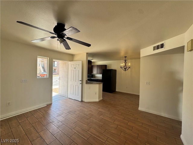 1505 Frank Aved St Unit 101, Las Vegas, NV 89110 - unfurnished living room featuring a chandelier, wood tiled floors, a ceiling fan, and a textured ceiling
