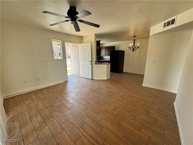1505 Frank Aved St Unit 101, Las Vegas, NV 89110 - unfurnished living room featuring a chandelier, dark wood finished floors, and ceiling fan