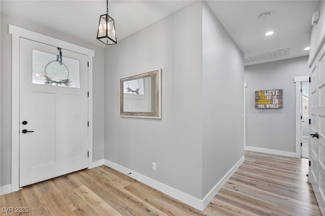 1395 Logandale Dr, Logandale, NV 89021 - foyer entrance with baseboards, light wood-style floors, and recessed lighting