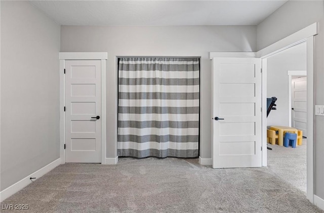 1395 Logandale Dr, Logandale, NV 89021 - unfurnished bedroom featuring carpet and baseboards