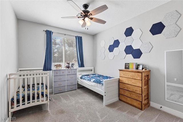 1395 Logandale Dr, Logandale, NV 89021 - bedroom featuring carpet, baseboards, and a ceiling fan