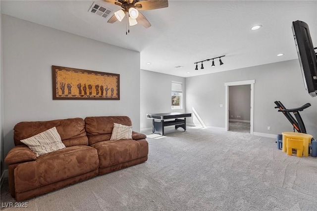 1395 Logandale Dr, Logandale, NV 89021 - living area featuring carpet floors, a ceiling fan, rail lighting, baseboards, and recessed lighting