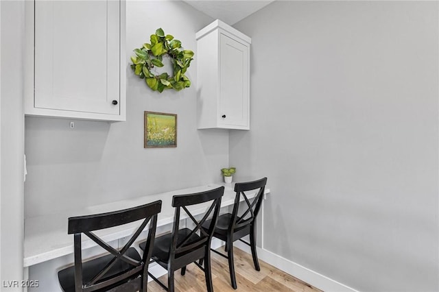 1395 Logandale Dr, Logandale, NV 89021 - dining room with light wood-style floors and baseboards