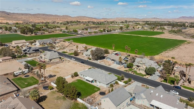 1395 Logandale Dr, Logandale, NV 89021 - aerial view of property and surrounding area featuring nearby suburban area and a mountainous background