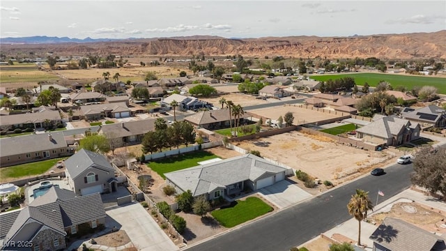 1395 Logandale Dr, Logandale, NV 89021 - aerial view of residential area featuring a mountainous background