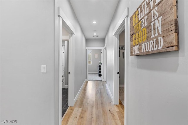 1395 Logandale Dr, Logandale, NV 89021 - corridor featuring light wood-type flooring, baseboards, and recessed lighting
